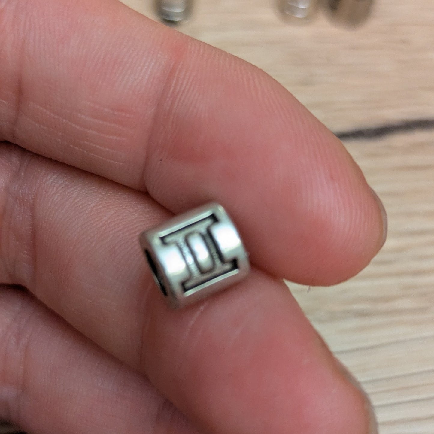 Metal horoscope beads